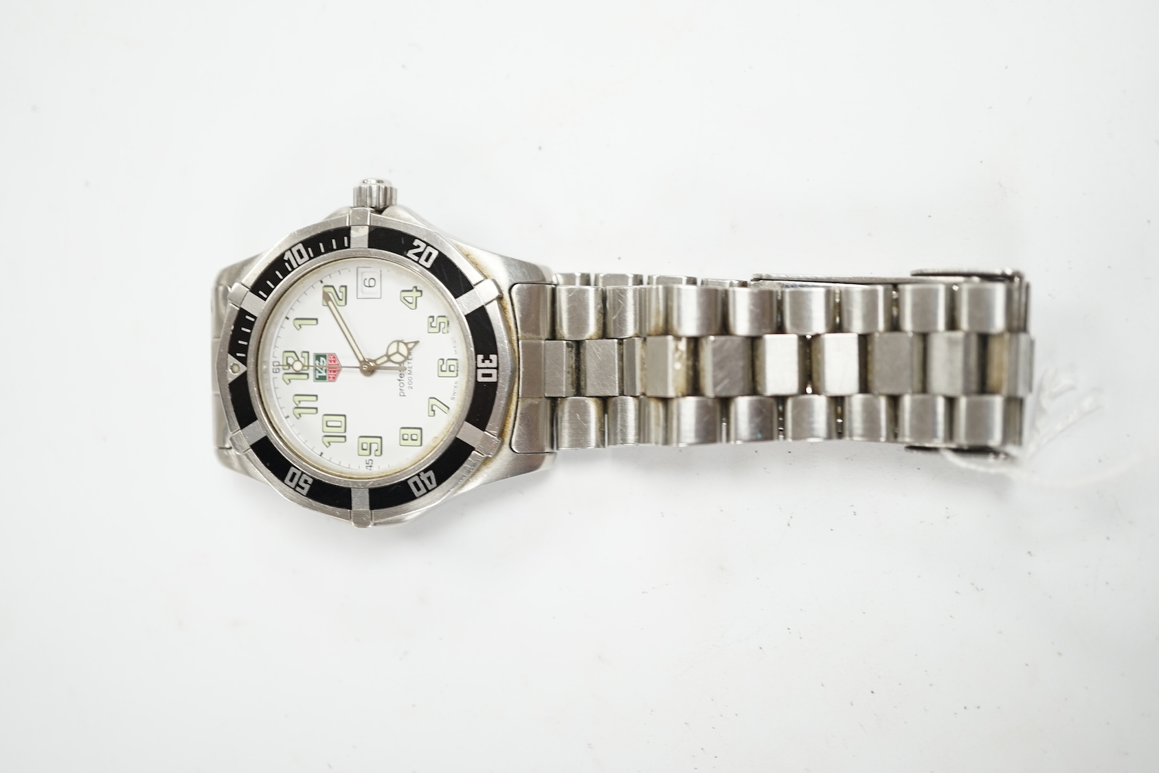 A gentleman's recent stainless steel Tag Heuer Professional quartz wrist watch, no box or papers. Condition - poor to fair